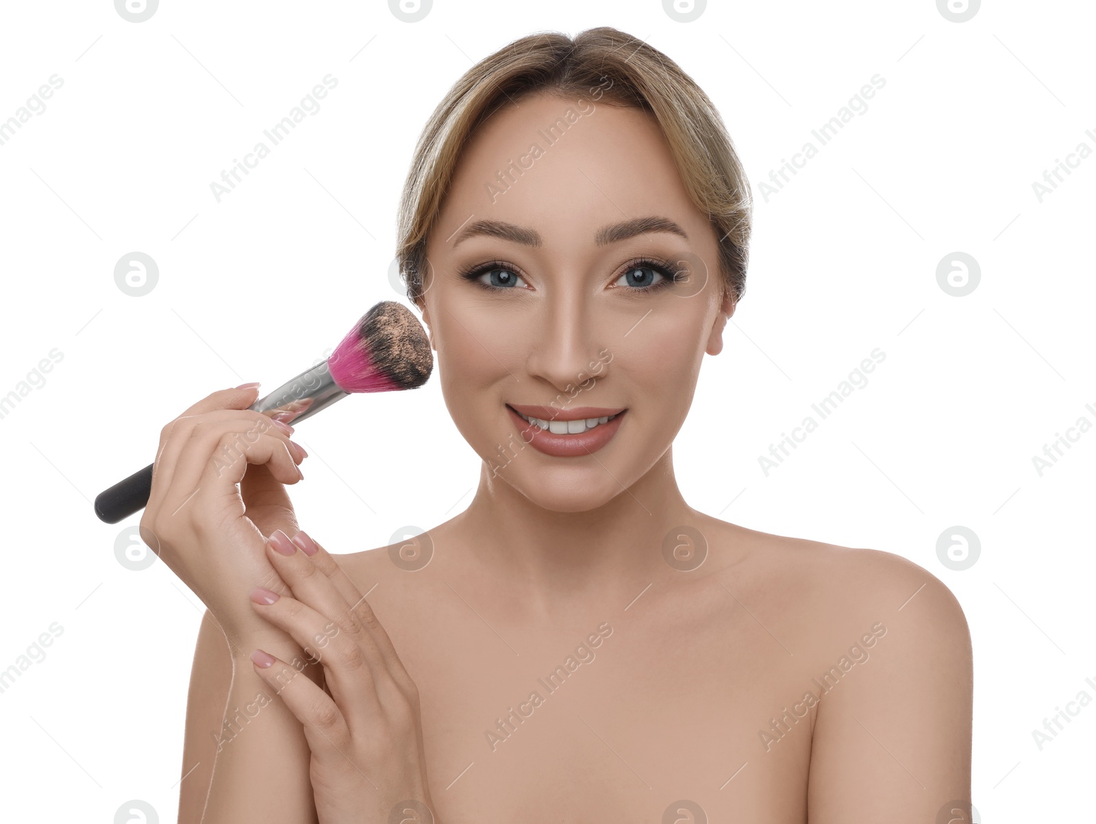 Photo of Beautiful young woman applying face powder with brush on white background