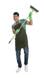 Photo of Emotional man with green broom on white background