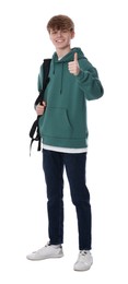 Teenage boy with backpack showing thumb up on white background