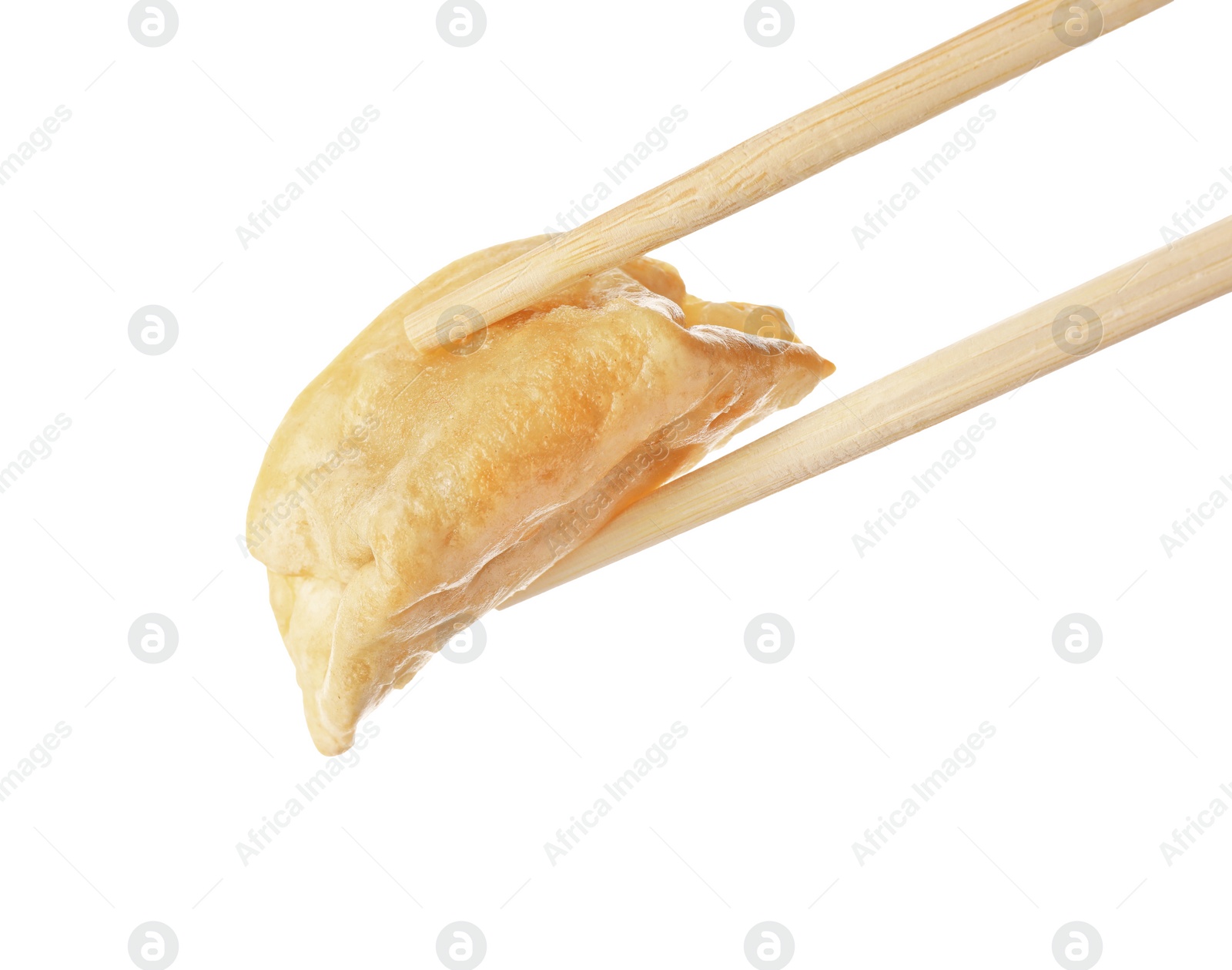 Photo of Chopsticks with delicious gyoza (asian dumpling) isolated on white