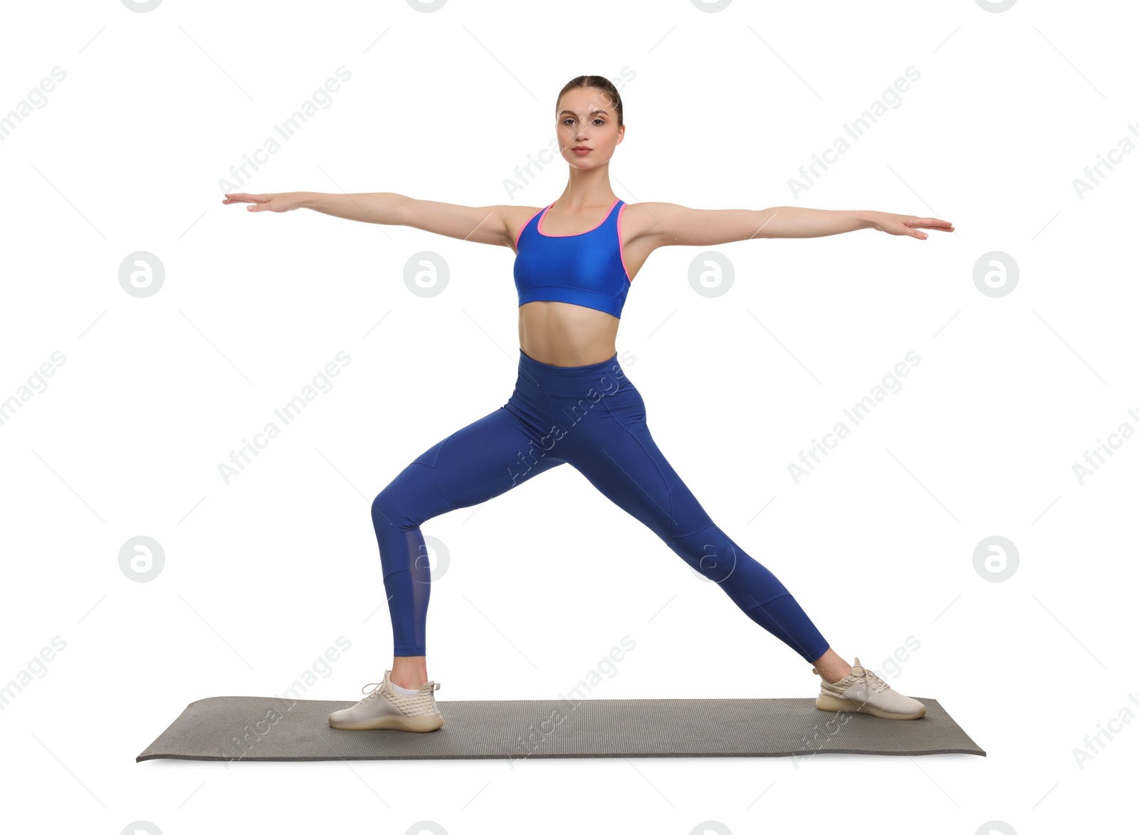 Photo of Young woman practicing yoga on white background