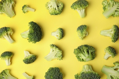 Photo of Flat lay composition with fresh green broccoli on color background