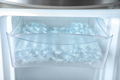 Photo of Plastic bags with ice cubes in fridge