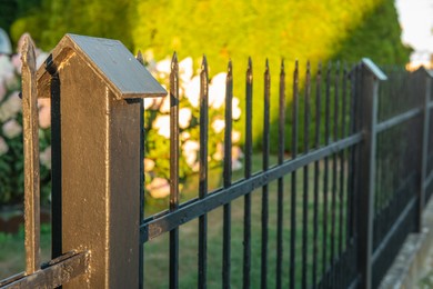 Railing of beautiful black iron fence outdoors, closeup