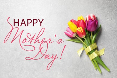 Image of Happy Mother's Day. Beautiful tulips on light grey background, top view