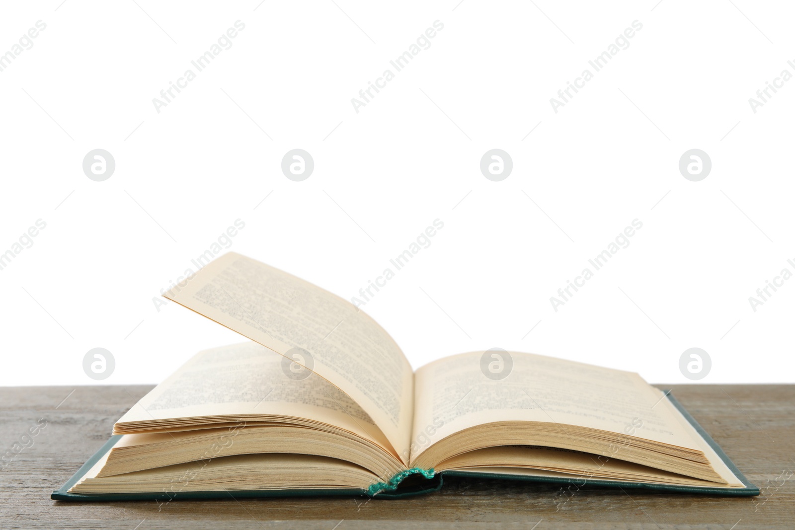 Photo of Open old hardcover book on wooden table