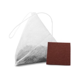 Photo of New tea bag with label on white background