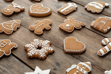 Photo of Many different delicious Christmas cookies on wooden table