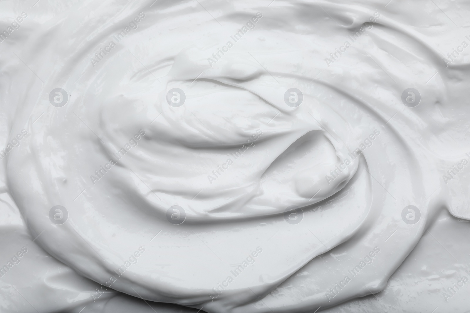 Photo of Closeup view of white body cream as background