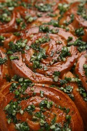Photo of Traditional Ukrainian garlic bread with herbs (Pampushky), closeup view