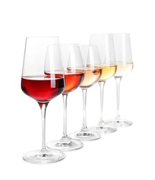 Row of glasses with different wines on white background