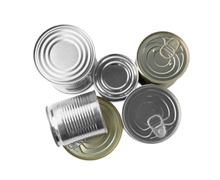 Photo of Many closed tin cans isolated on white, top view