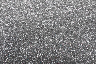 Beautiful shiny grey glitter as background, closeup