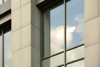 Modern office building with tinted windows. Urban architecture