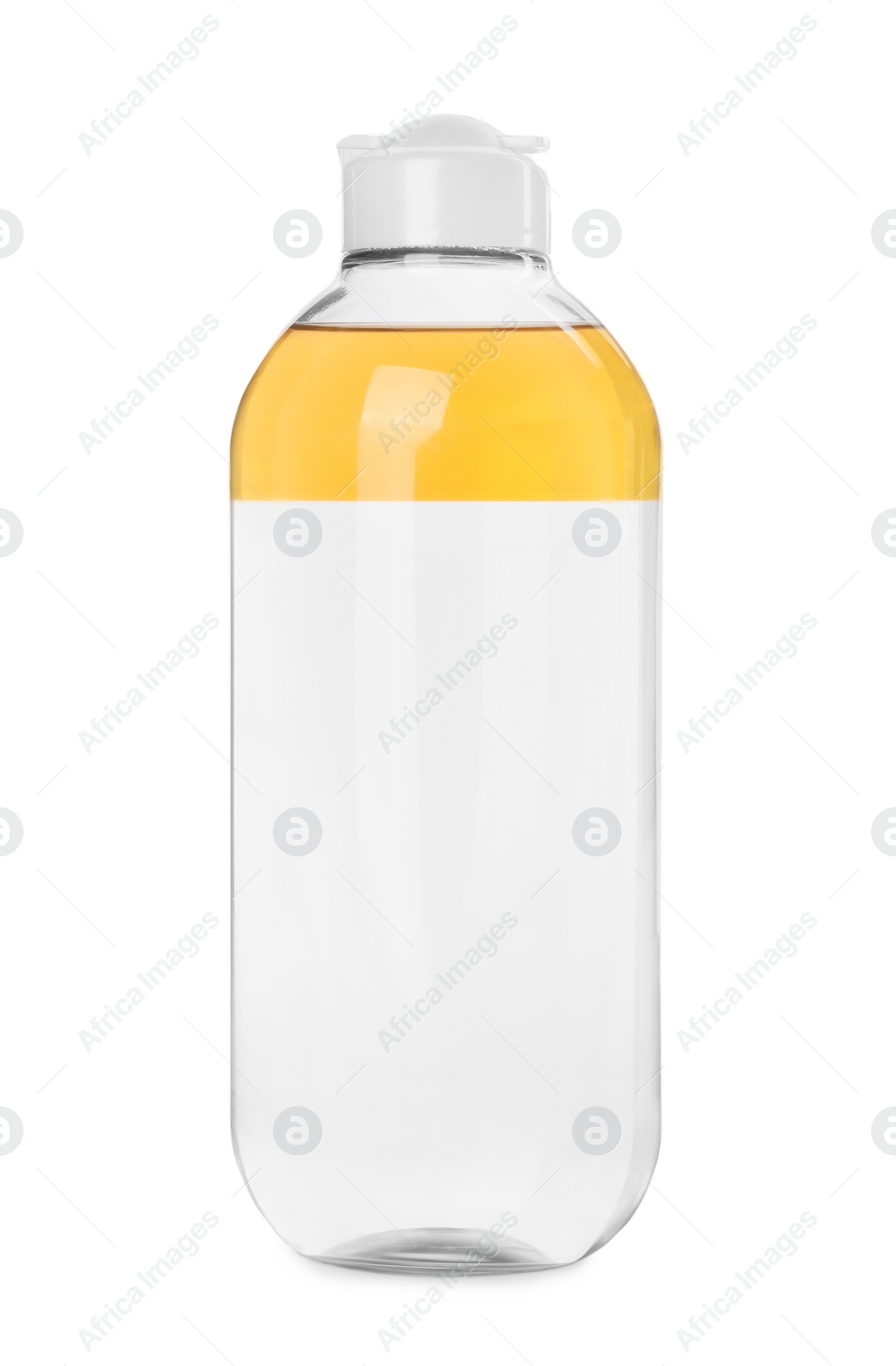 Photo of Bottle of micellar cleansing water and cotton pads on white background