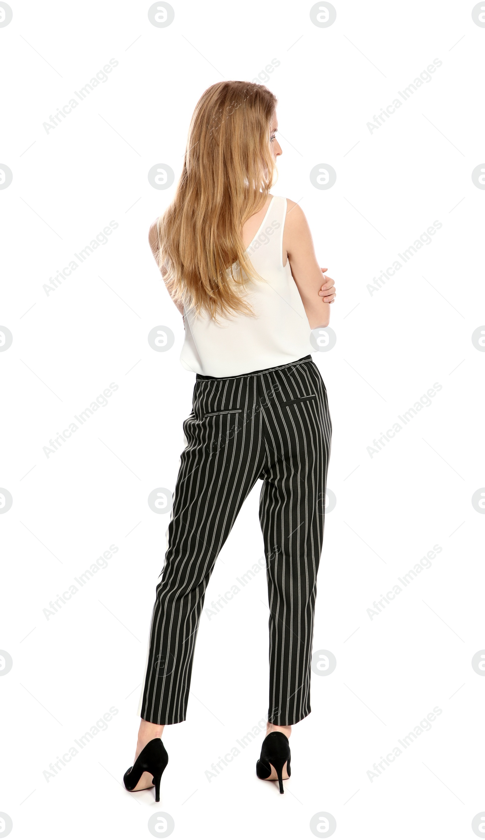 Photo of Young long haired woman posing on white background