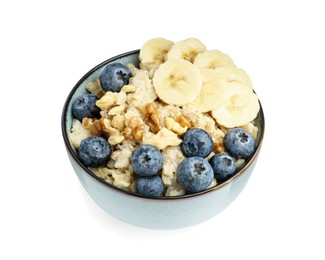 Photo of Tasty oatmeal with banana, blueberries and walnuts in bowl isolated on white