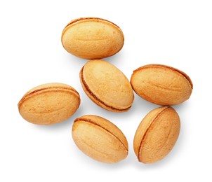 Photo of Delicious nut shaped cookies with boiled condensed milk on white background, top view