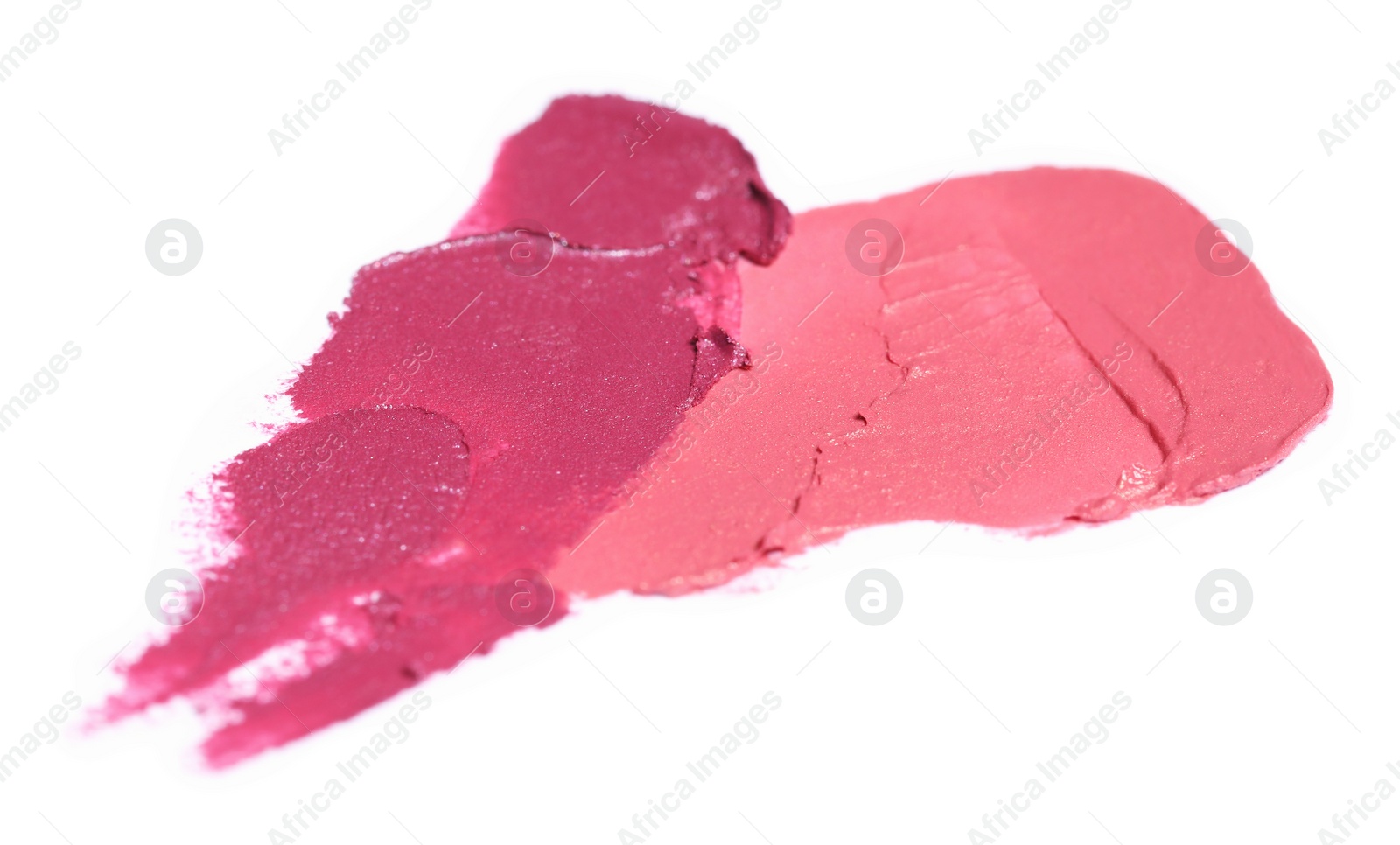 Photo of Smears of bright lipsticks on white background