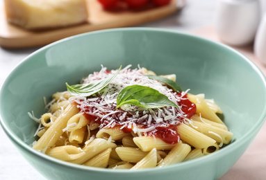 Photo of Delicious pasta with tomato sauce, closeup view