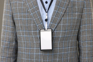 Photo of Closeup view of man with blank badge