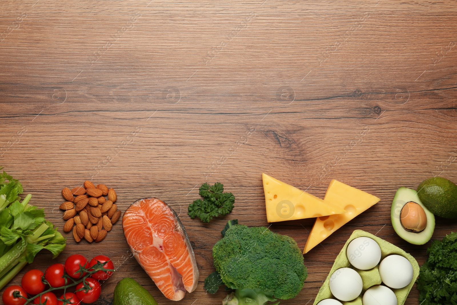 Photo of Flat lay composition with fresh organic products on wooden table, space for text. Keto diet