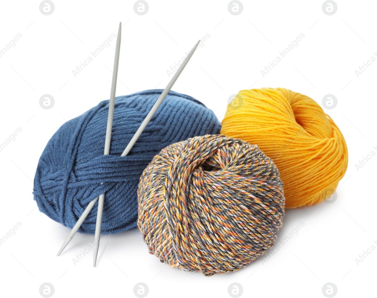 Photo of Different balls of woolen knitting yarns and needles on white background