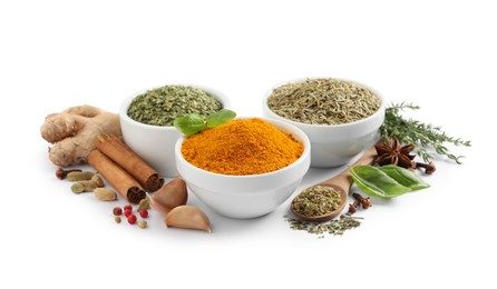 Different natural spices and herbs on white background