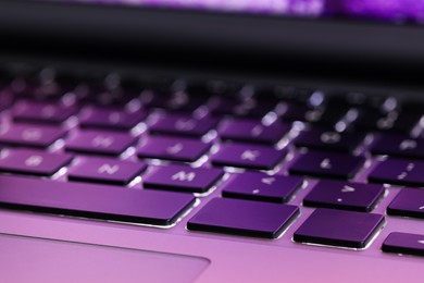 Photo of Closeup view of modern laptop keyboard as background