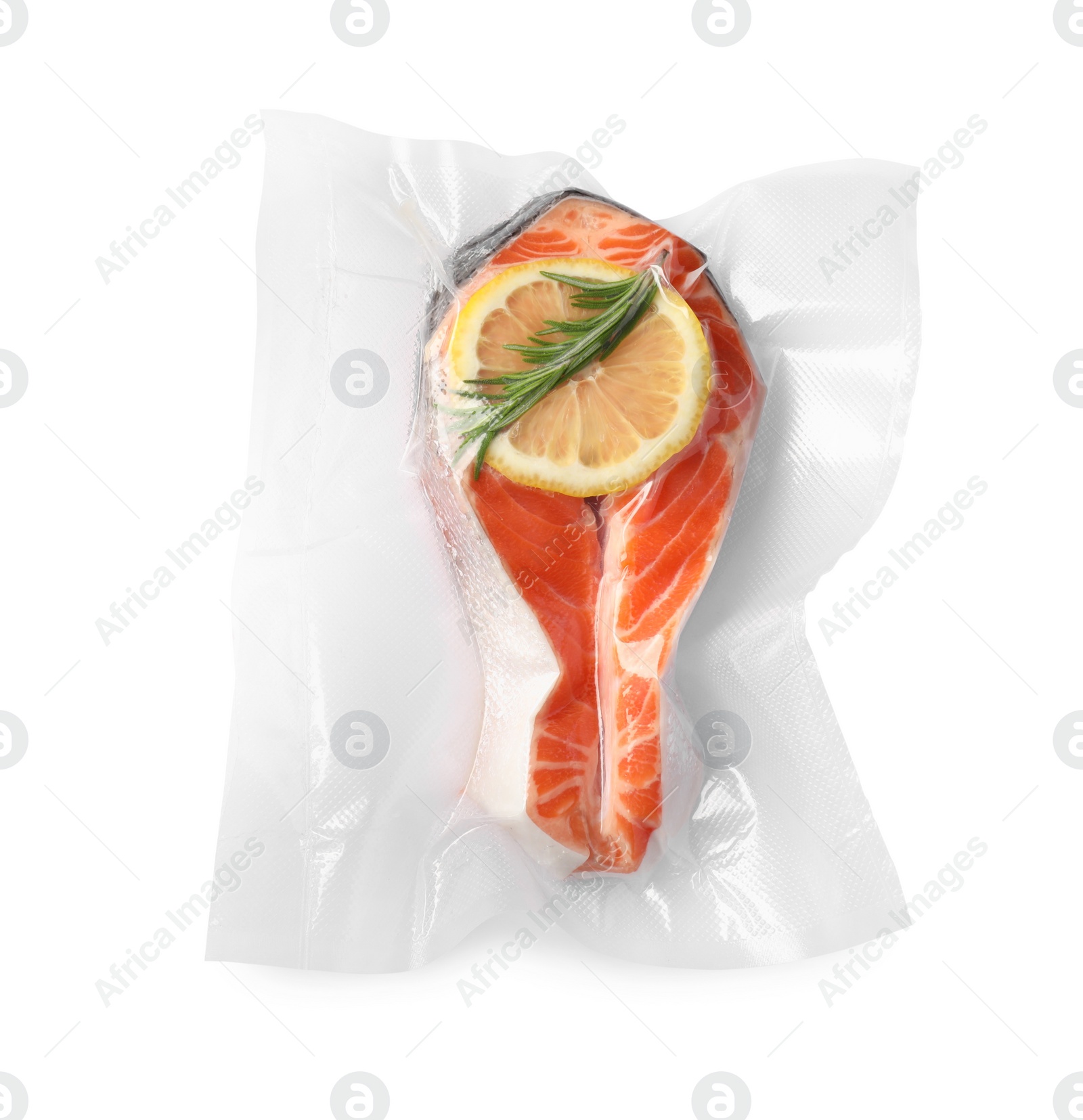 Photo of Salmon with lemon in vacuum pack on white background, top view