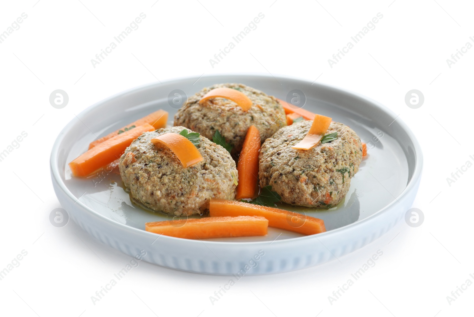 Photo of Plate of traditional Passover (Pesach) gefilte fish on white background