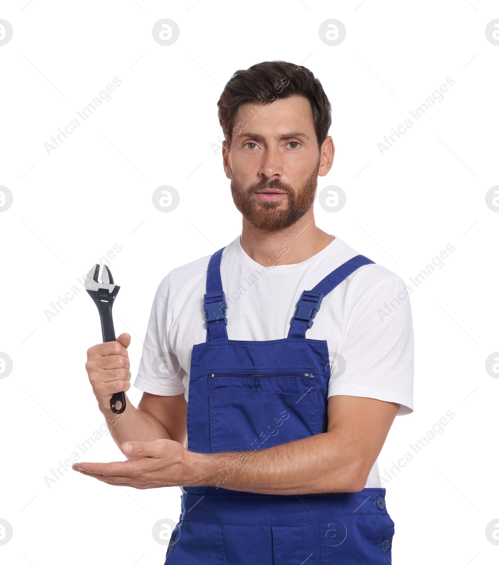 Photo of Professional plumber with adjustable wrench on white background