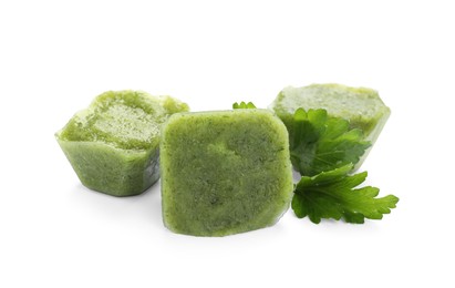 Photo of Frozen broccoli puree cubes and ingredient isolated on white