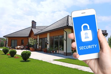 Image of Home security system. Woman with smartphone near her house outdoors, closeup