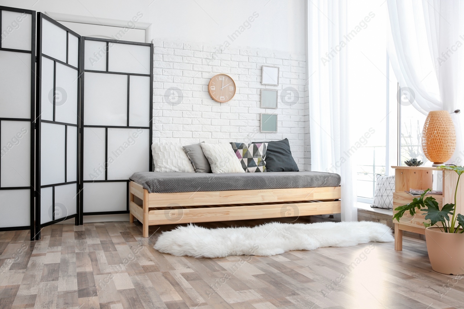 Photo of Modern living room interior with wooden furniture and furry carpet