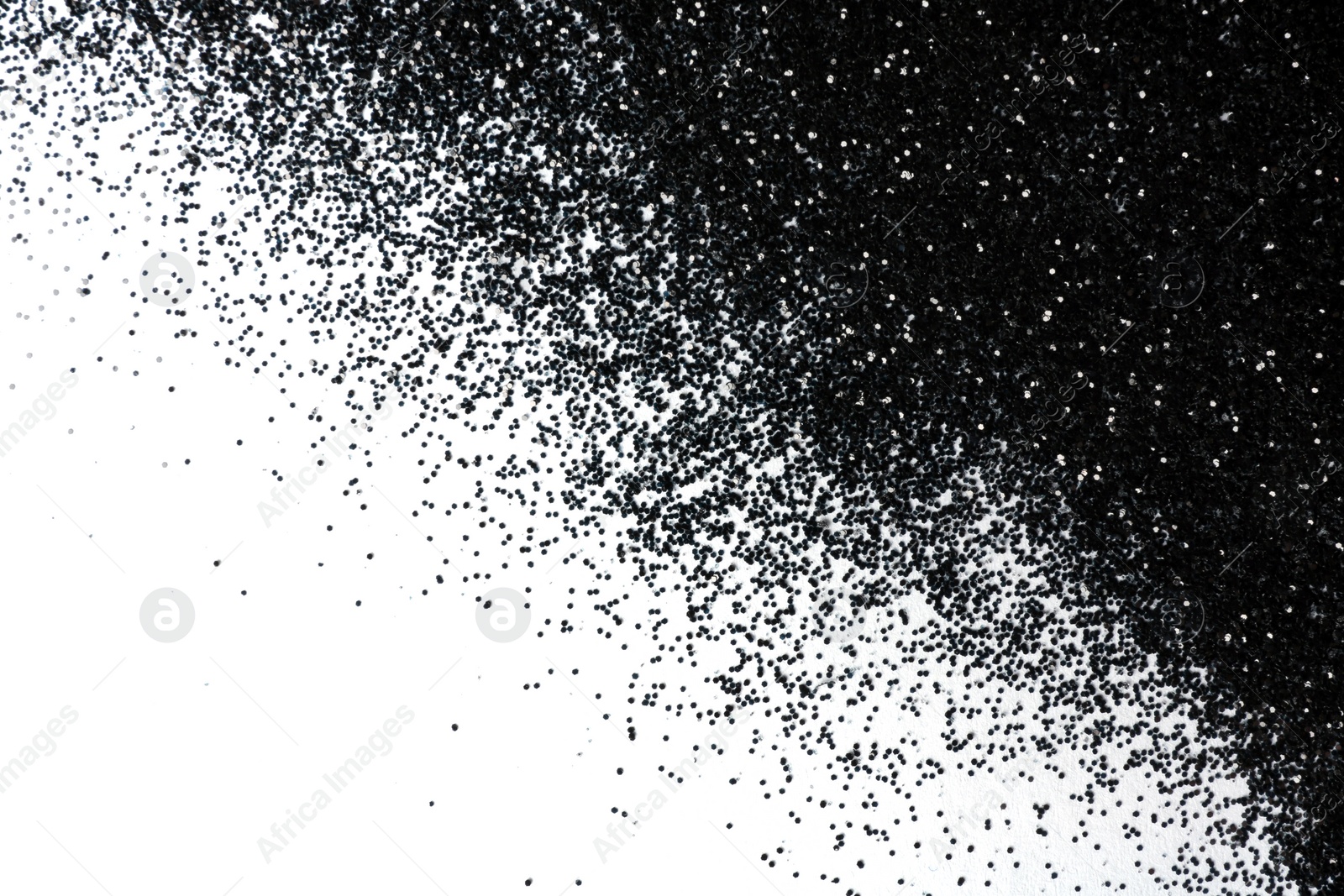 Photo of Shiny black glitter on white background, top view with space for text