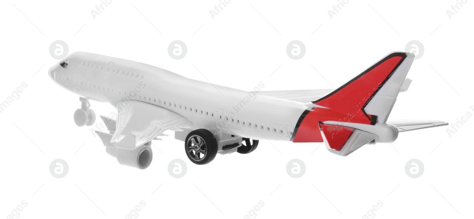 Photo of Toy airplane isolated on white. Travel concept