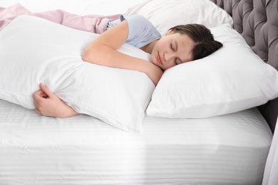 Photo of Beautiful little girl sleeping in bed at home