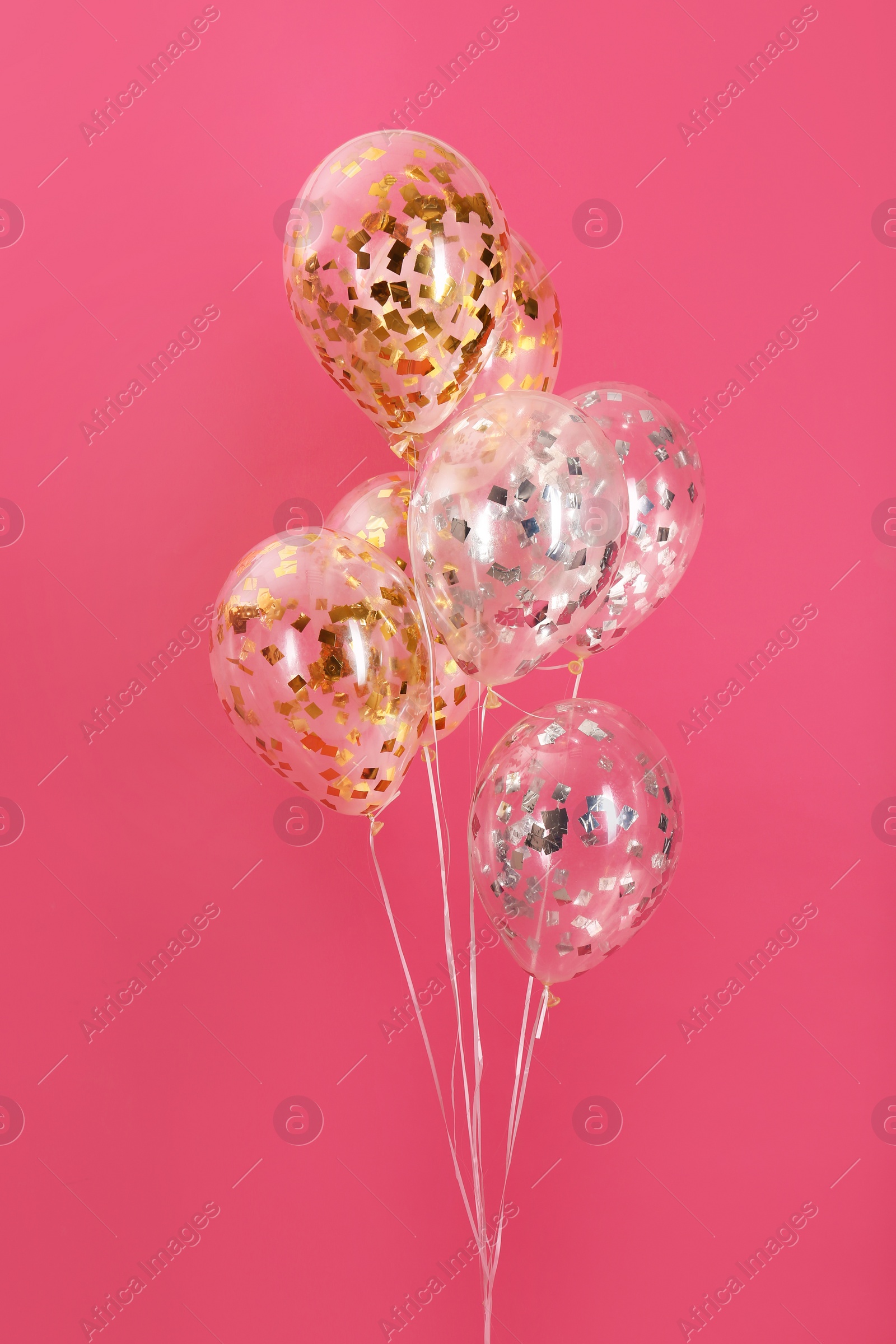 Photo of Bunch of bright balloons on color background