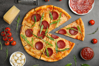 Photo of Flat lay composition with tasty pepperoni pizza on grey table