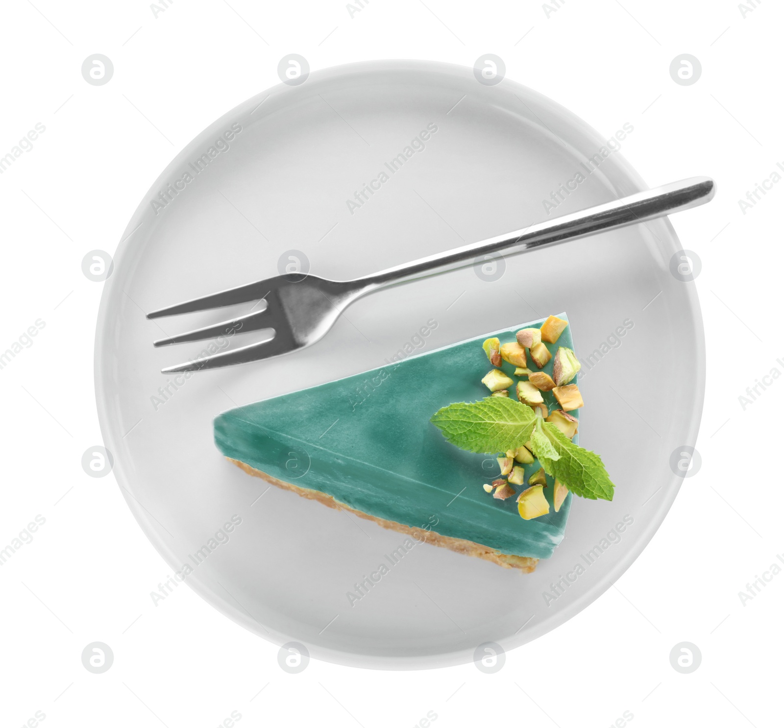 Photo of Plate with piece of delicious spirulina cheesecake isolated on white, top view