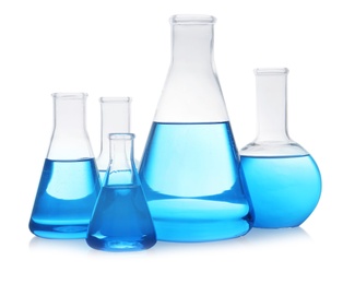 Photo of Florence and conical flasks with blue liquid on white background. Laboratory glassware