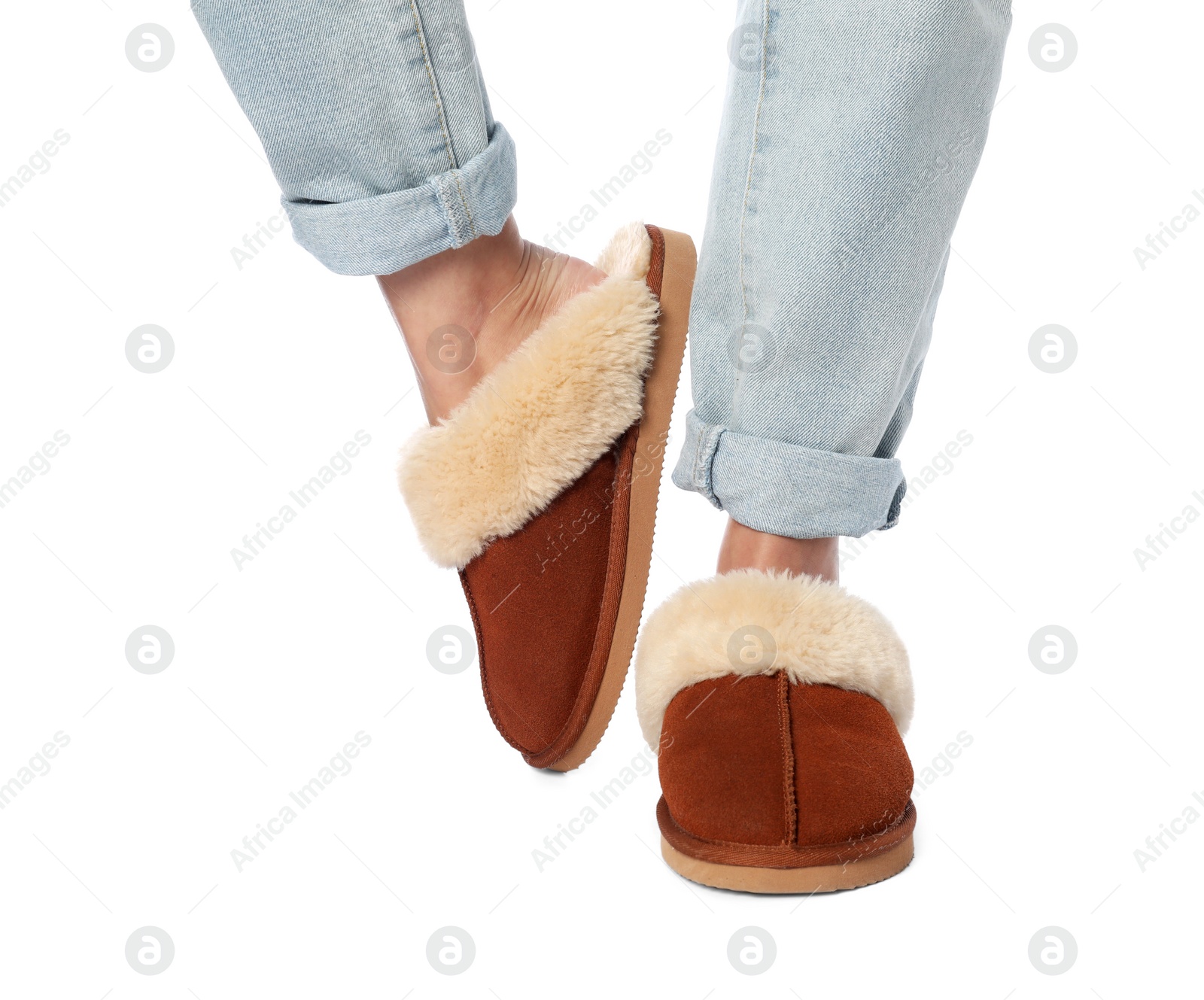 Photo of Woman in soft slippers on white background, closeup