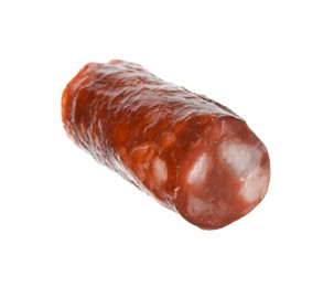 Photo of Piece of thin dry smoked sausage isolated on white