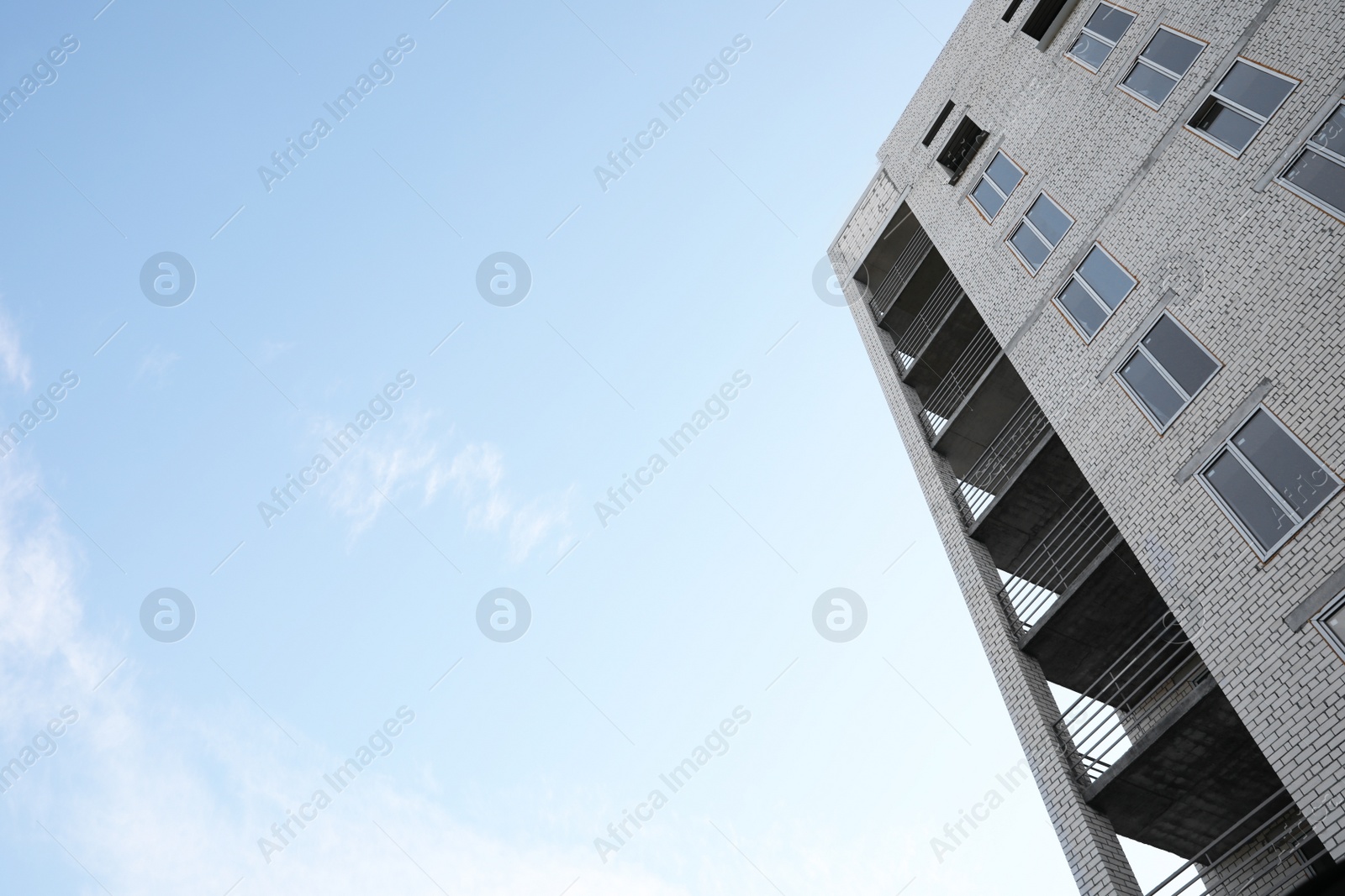 Photo of View of unfinished building against blue sky