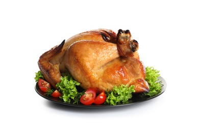 Photo of Platter of cooked turkey with garnish on white background