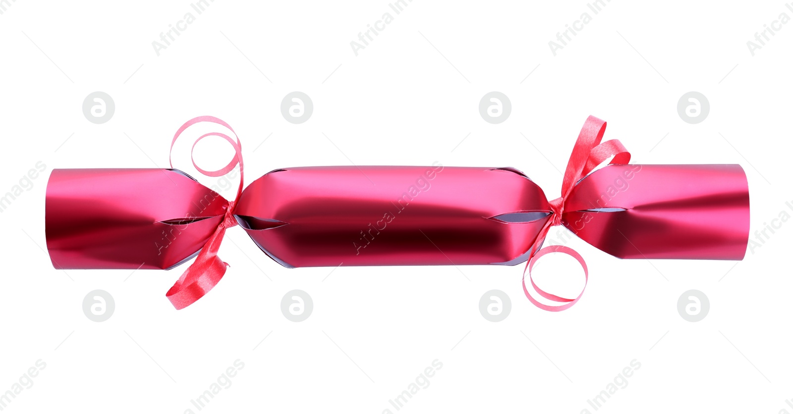 Photo of Bright red Christmas cracker isolated on white, top view