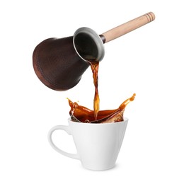 Pouring freshly brewed aromatic coffee from turkish pot into cup. Objects in air on white background