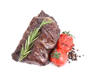 Piece of delicious grilled beef meat, tomatoes, peppercorns and rosemary isolated on white, top view