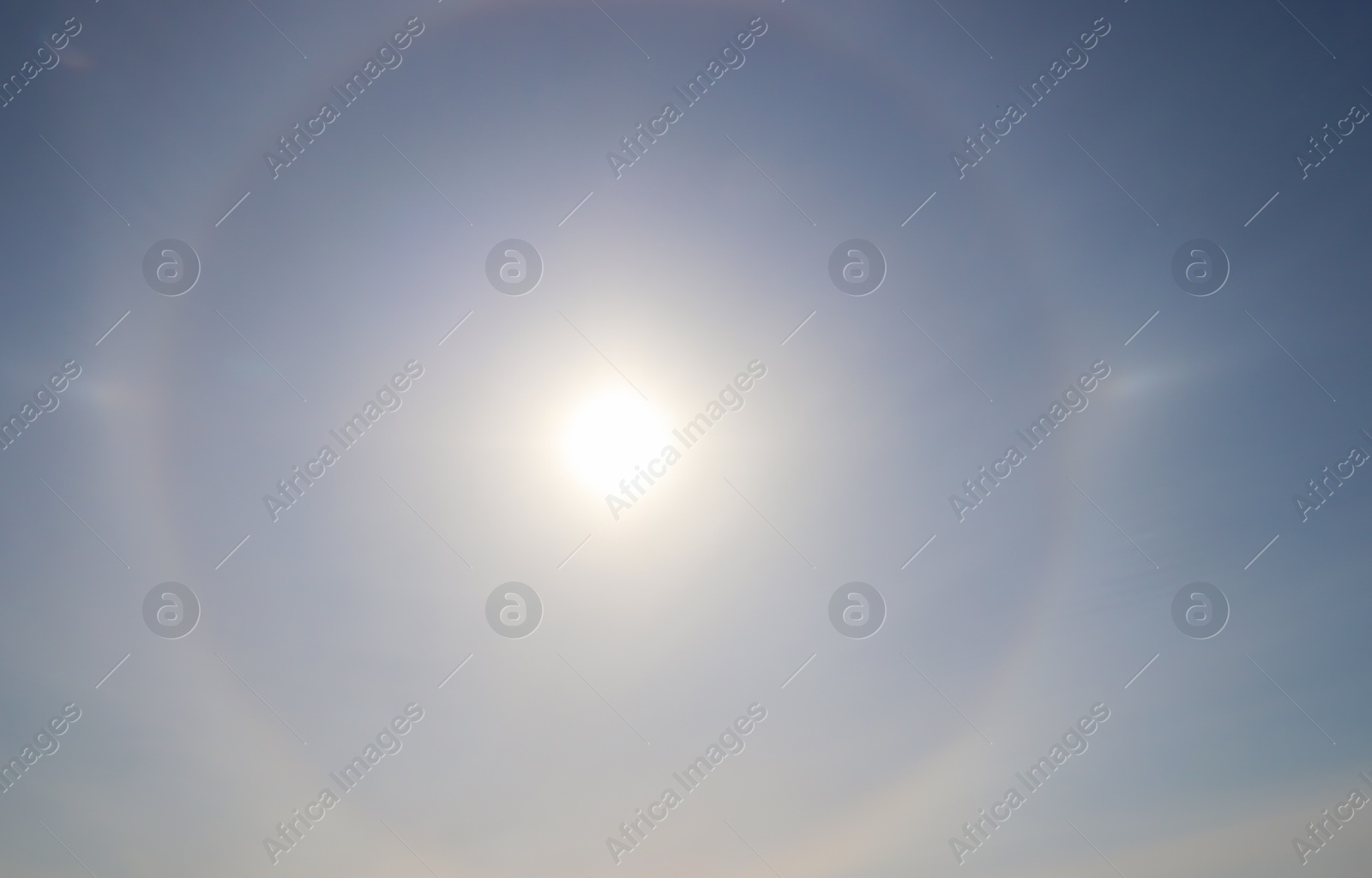 Photo of Beautiful view of sun halo in blue sky outdoors